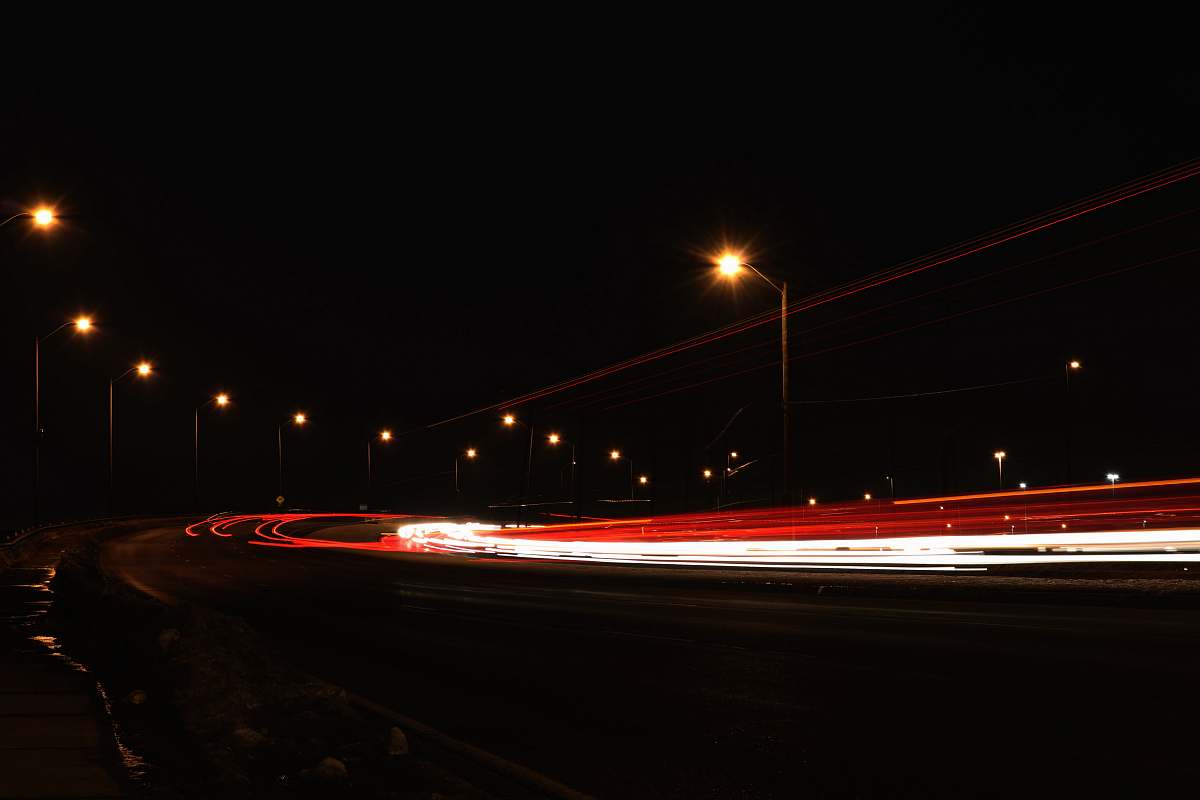 tail light timelapse photography of vehicles during nighttime head light